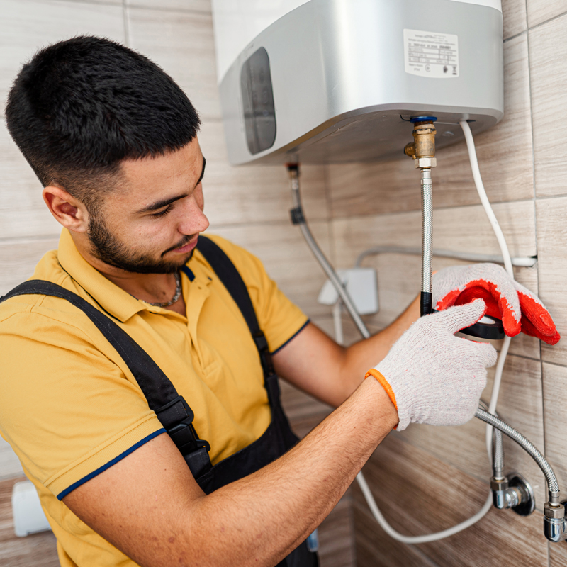 plumber repairing a water heater