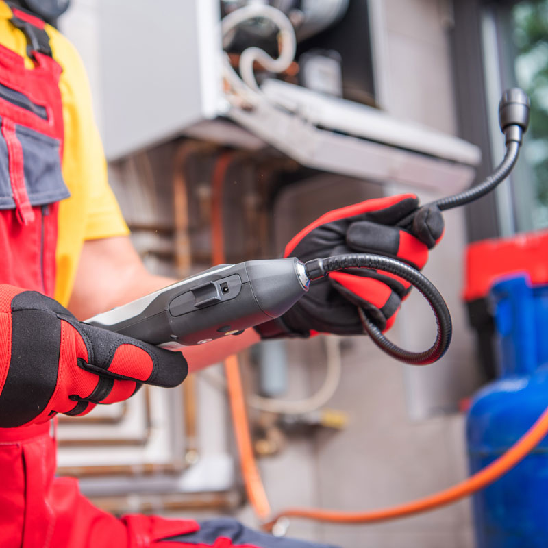 plumber using a leak detection device