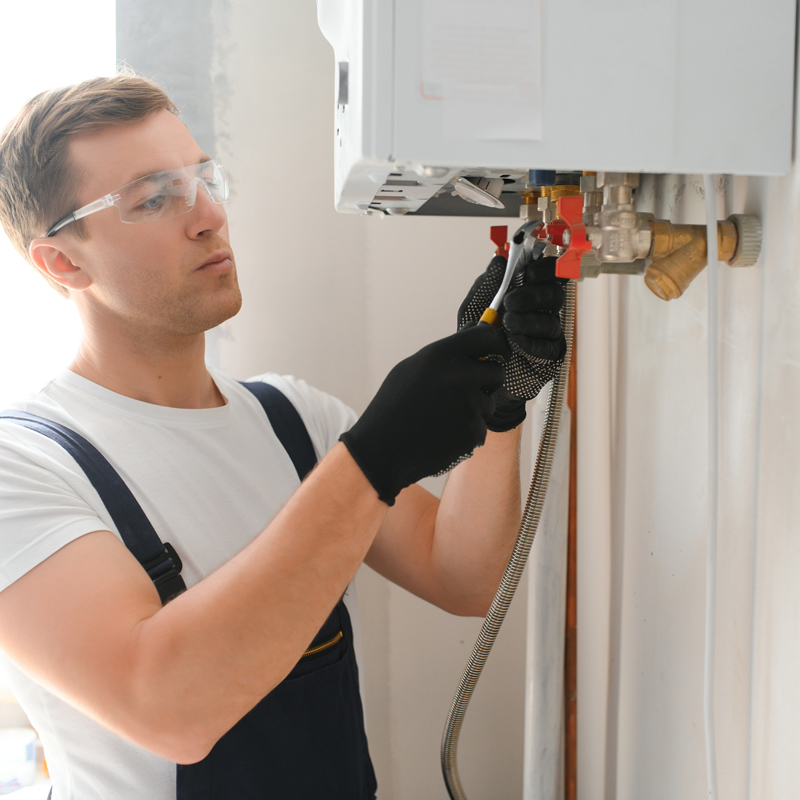 plumber cutting a pipe