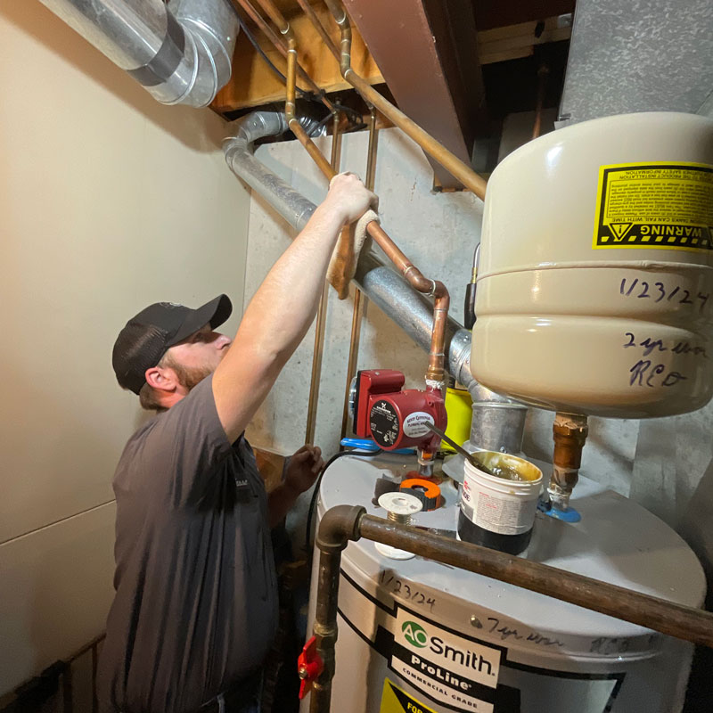 plumber repairing a water heater