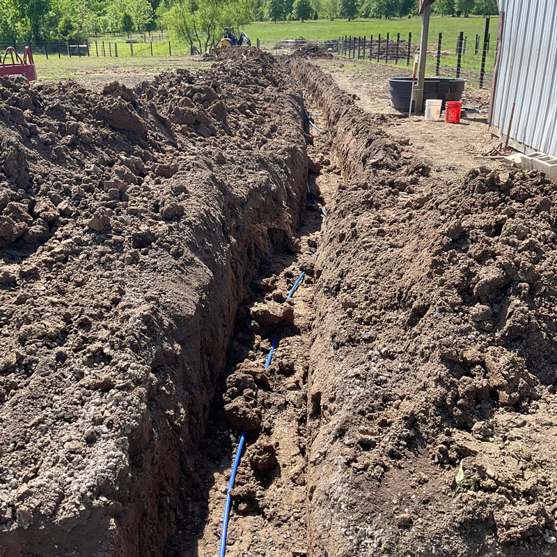 new pipe in dirt trench