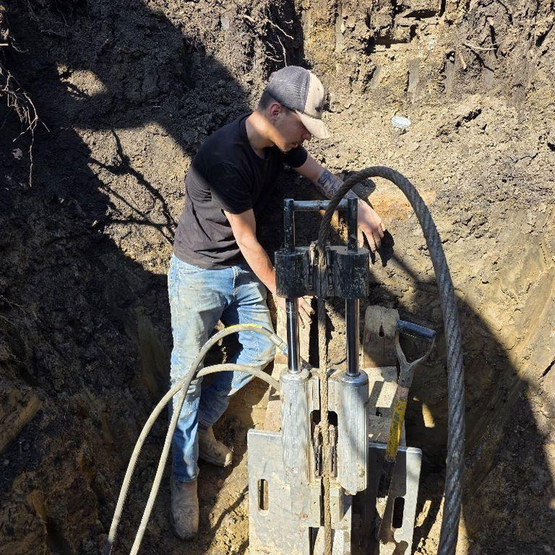 plumber fixing burst pipe
