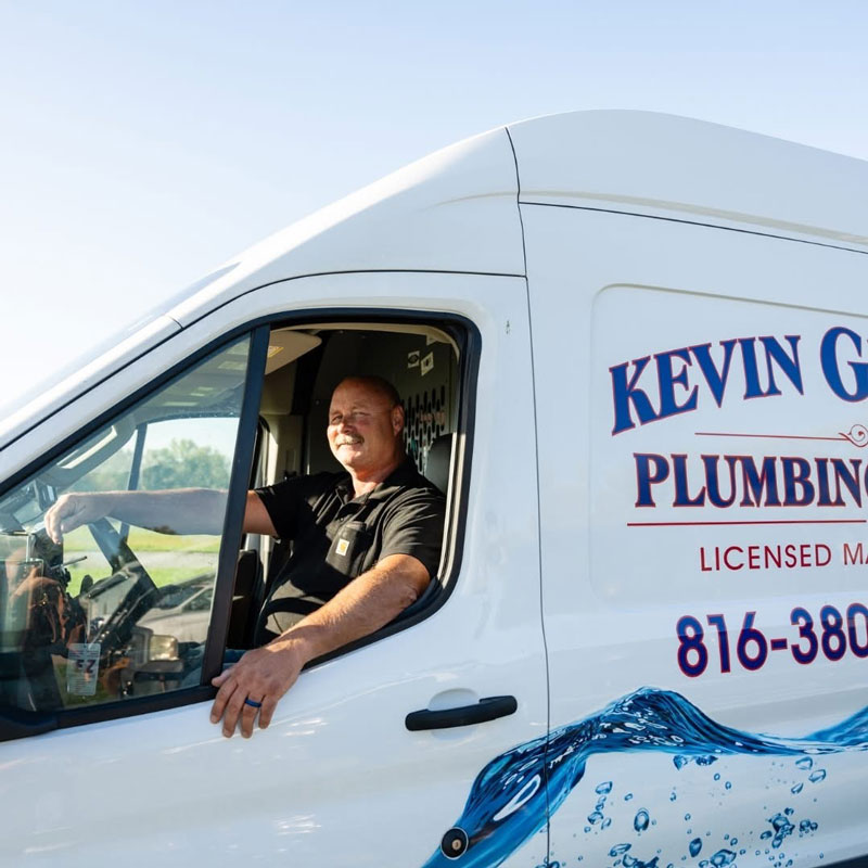 plumber sitting in a work van