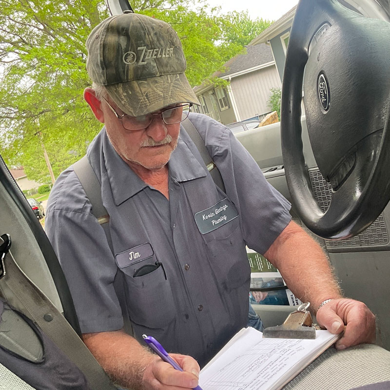 jim signing papers