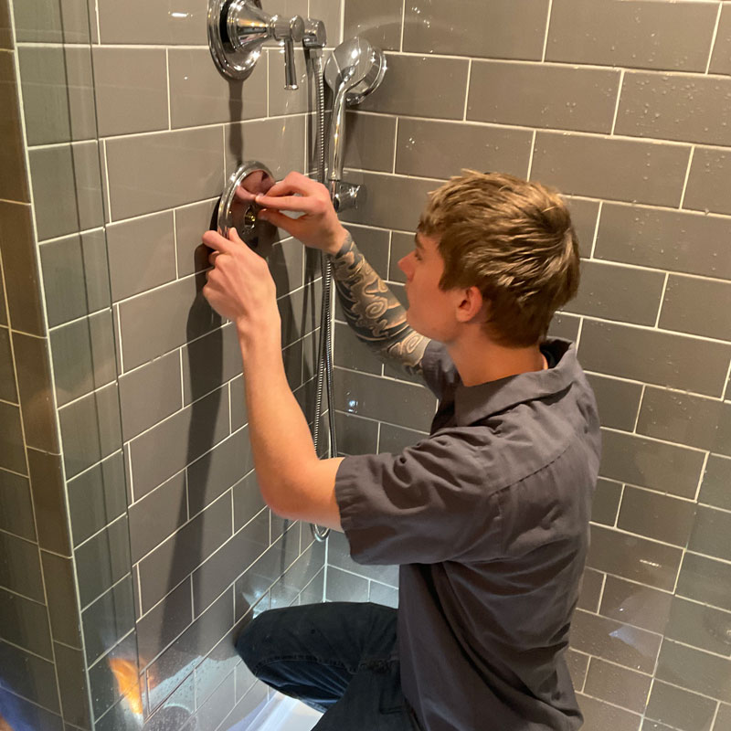 plumber repairing shower